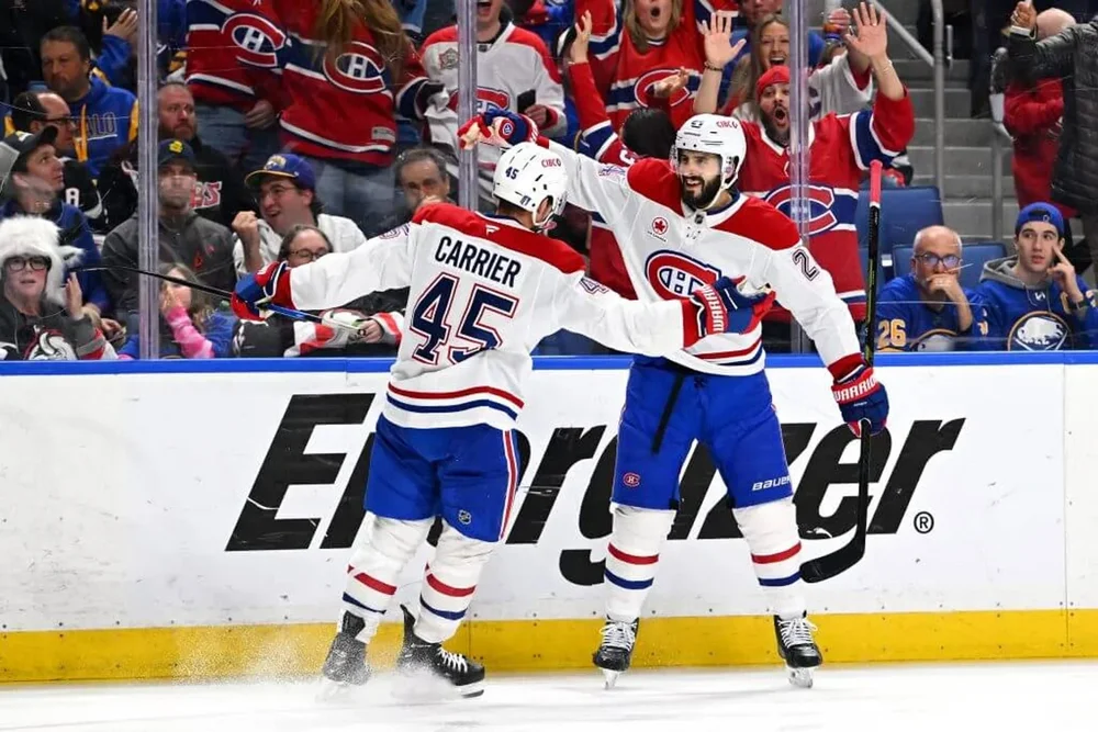 Alexandre Carrier, left, and Phillip Danault celebrate after a goal.
